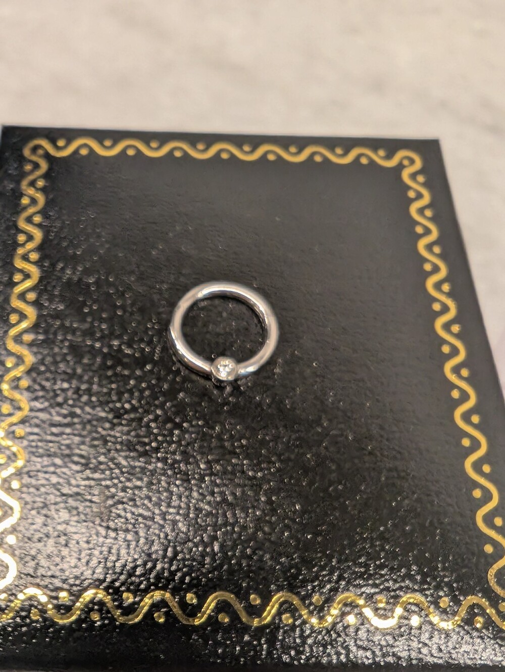 14k White Gold 16 Gauge Seamless Hoop With Side Diamond - Picture 2 of 4
